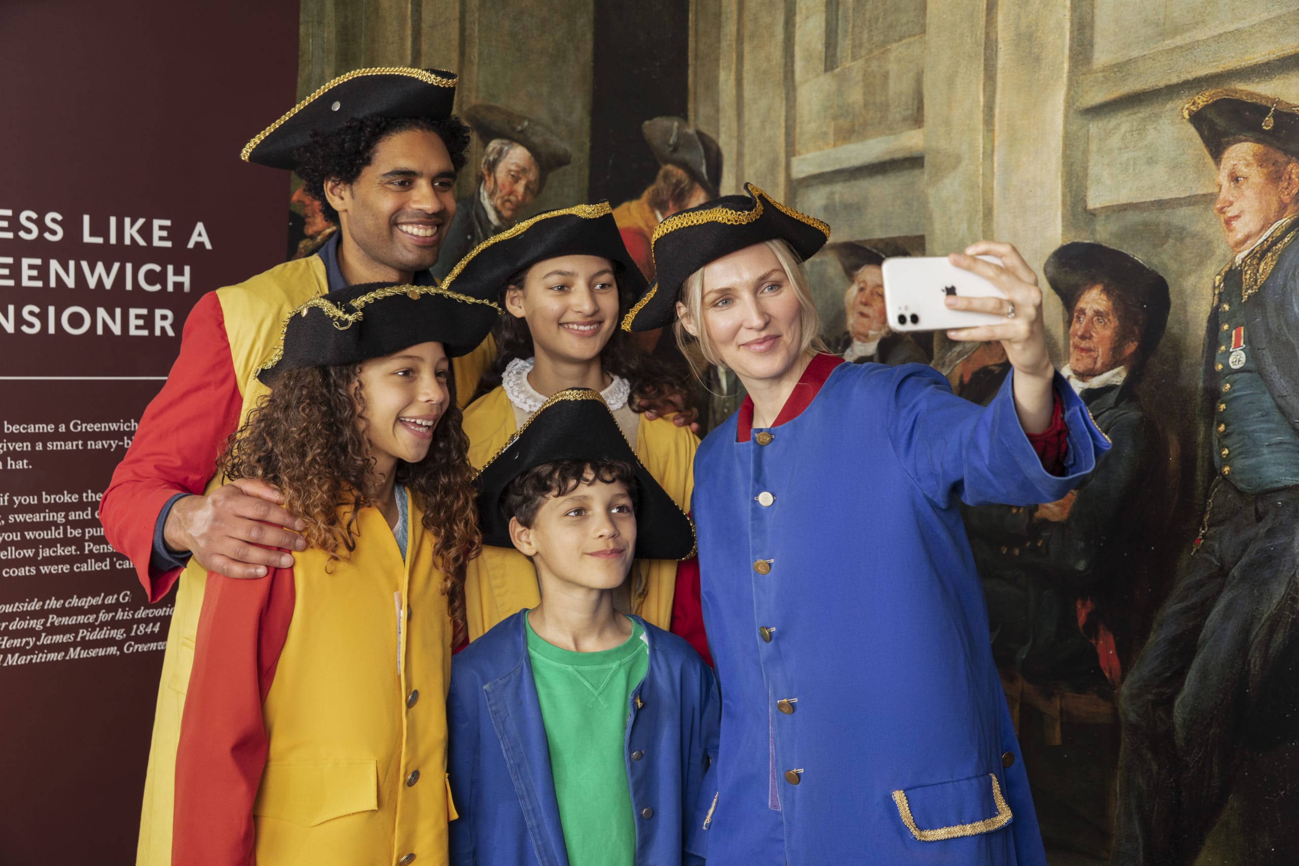 Family in visitor centre taking selfie